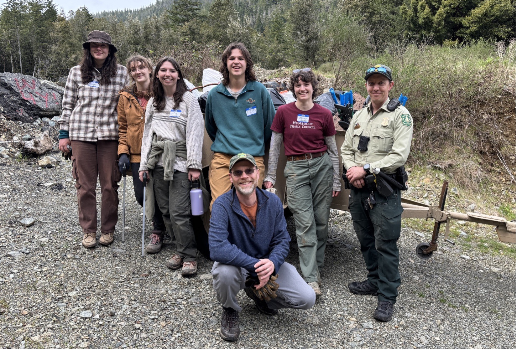 Volunteers and a Forest Service Law Enforcement Officer with 980 pounds of trash removed from a target shooting area in the South Fork Smith watershed (Photo- Grant Werschkull)