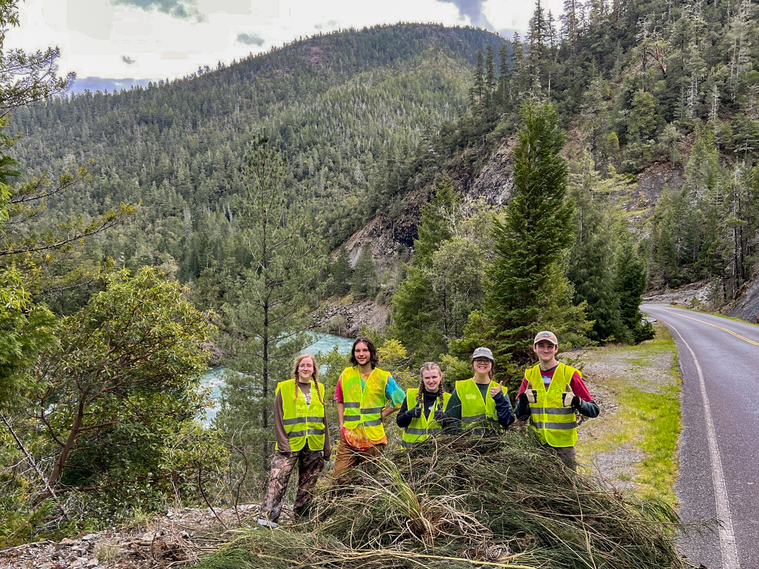 Cal Poly Humboldt students display invasive plants removed from the South Fork Smith watershed (Photo- Mike Splain)